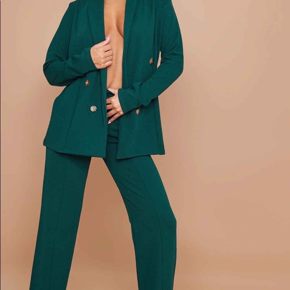 Emerald green suit.